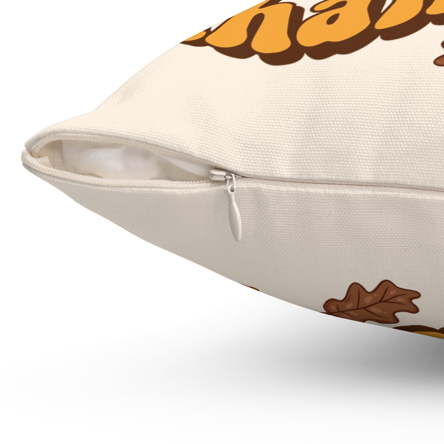 Decorative pillow with autumn-themed design on a white background