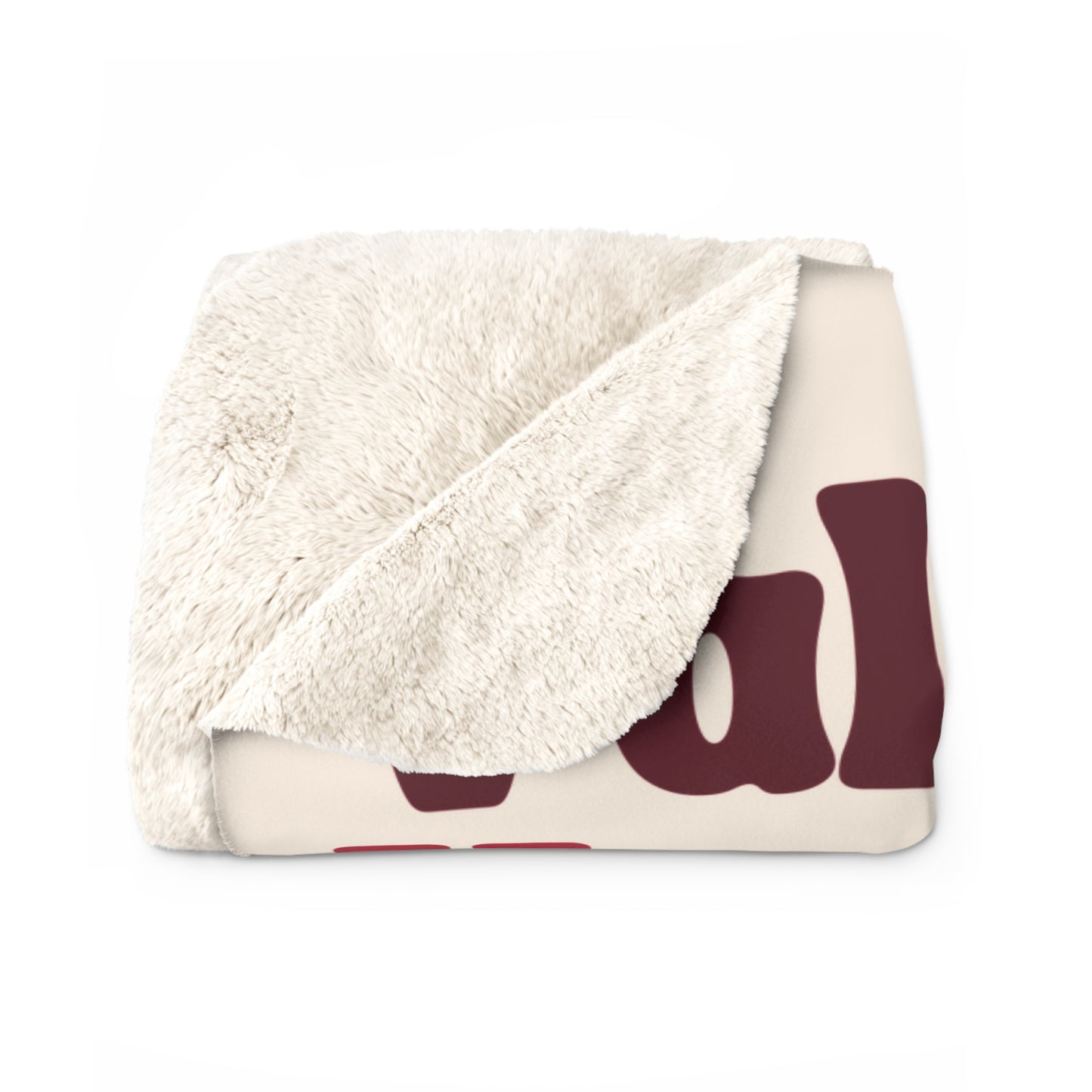 Folded blanket with white sherpa interior and burgundy abstract pattern on cream background, valentines word collage