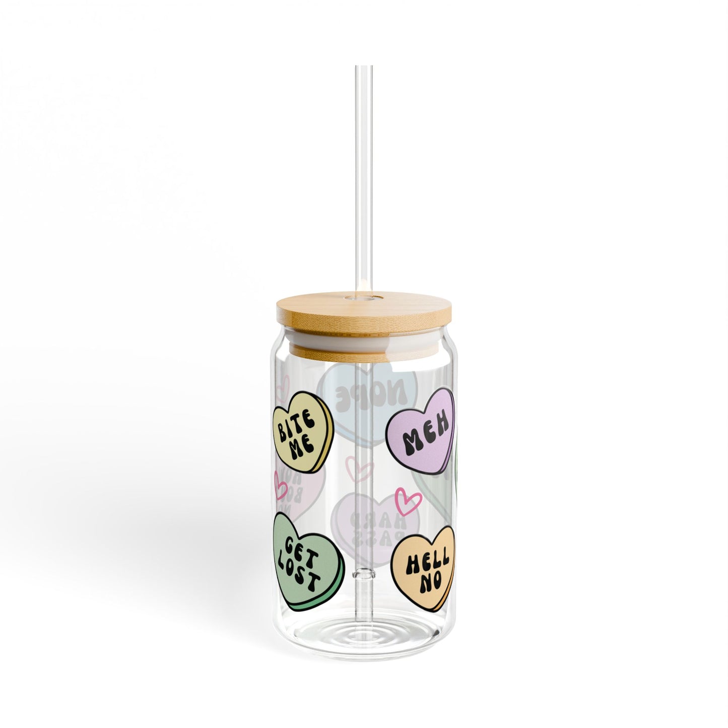 Clear tumbler with colorful heart-shaped stickers and a wooden lid on a white background, anti valentines candy heart messages