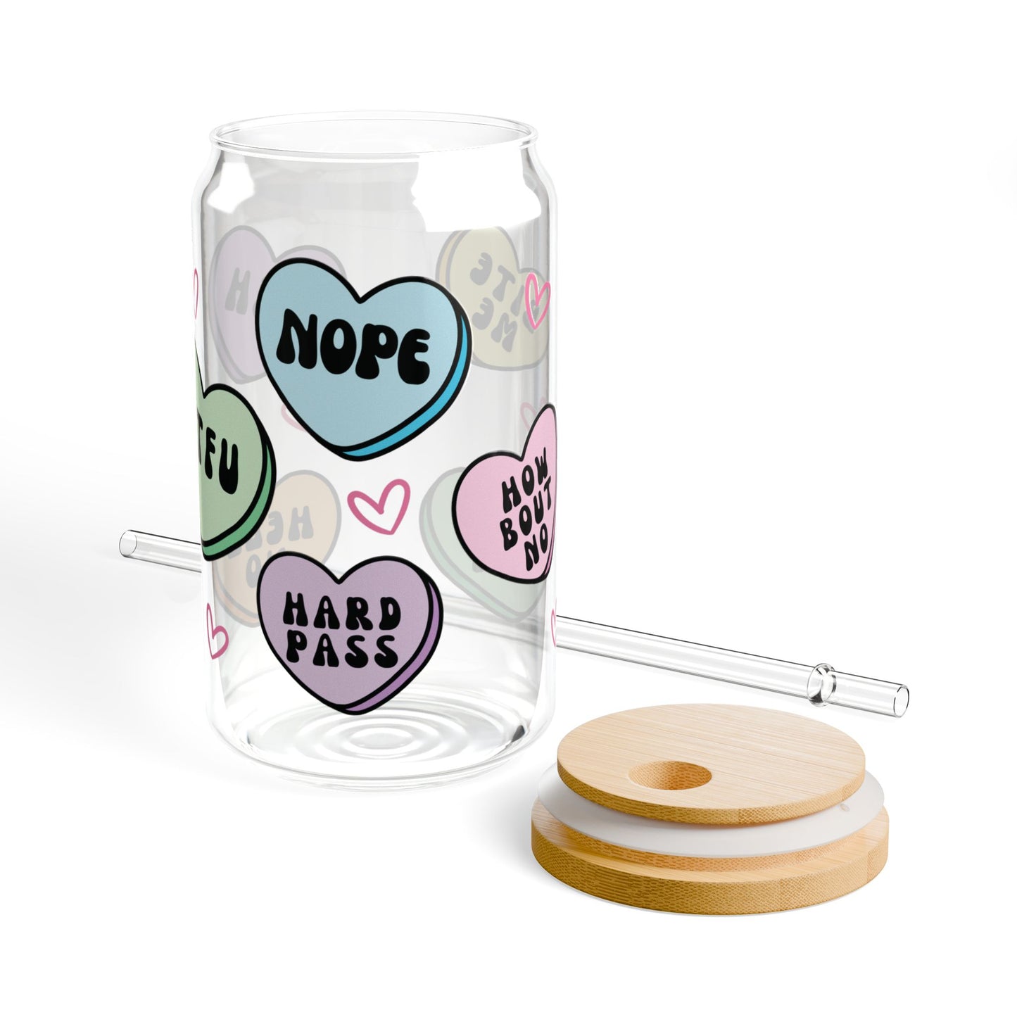 Clear tumbler with colorful heart-shaped text, wooden lid, and straw on a white background, anti valentines candy heart messages