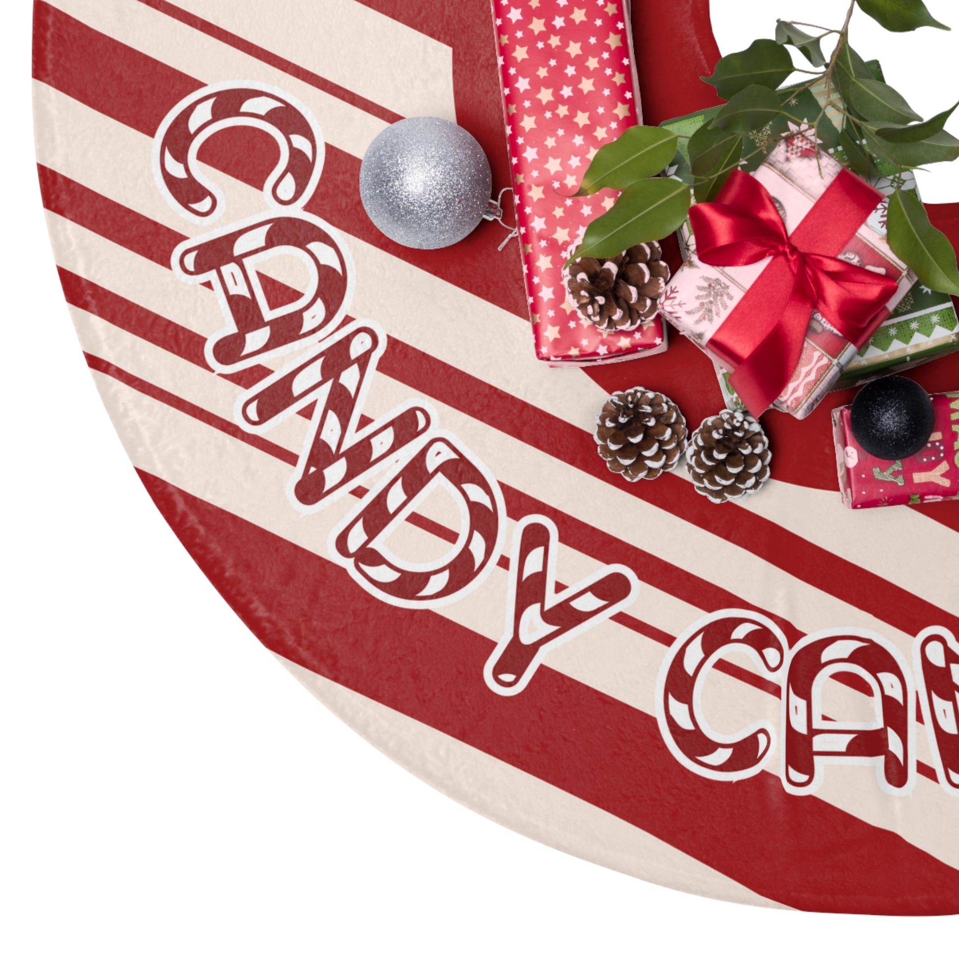 Christmas tree skirt with 'candy cane love' text, surrounded by Christmas decorations on a white background.