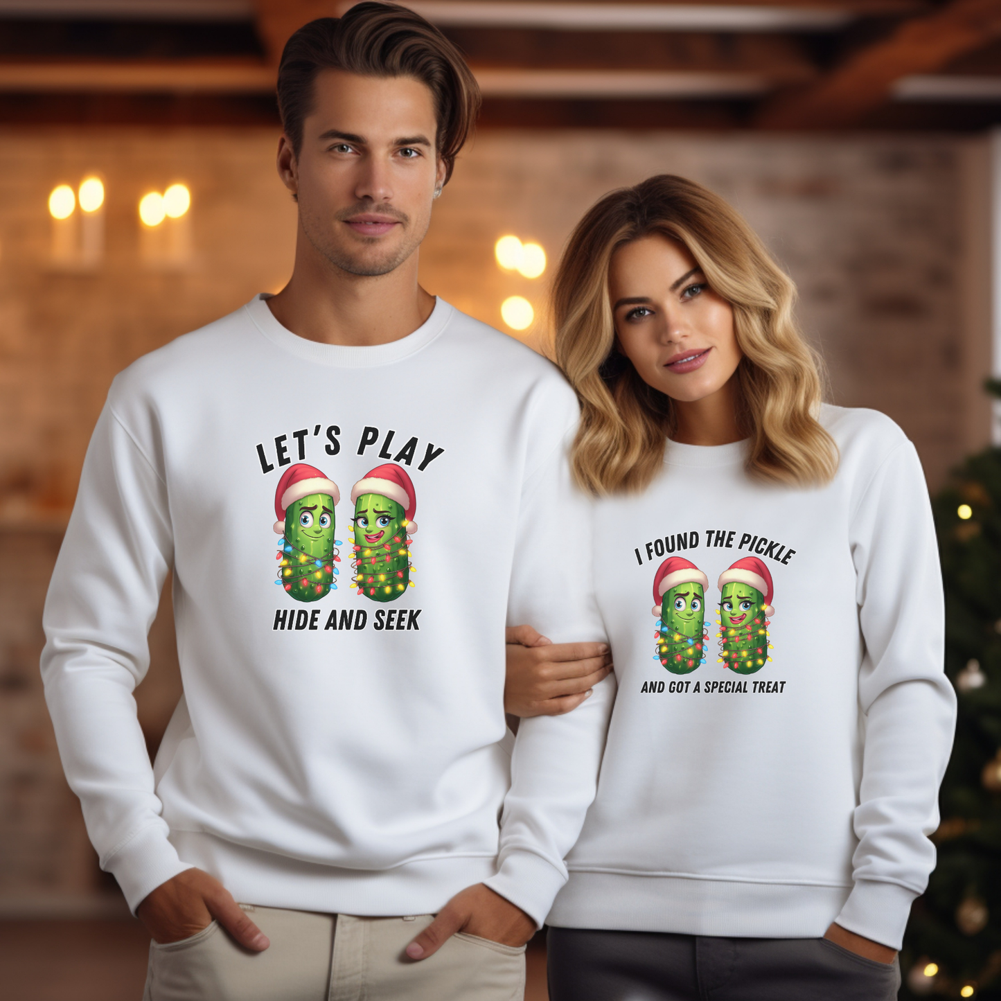 Two people wearing white sweatshirts with pickle-themed designs in a festive setting.