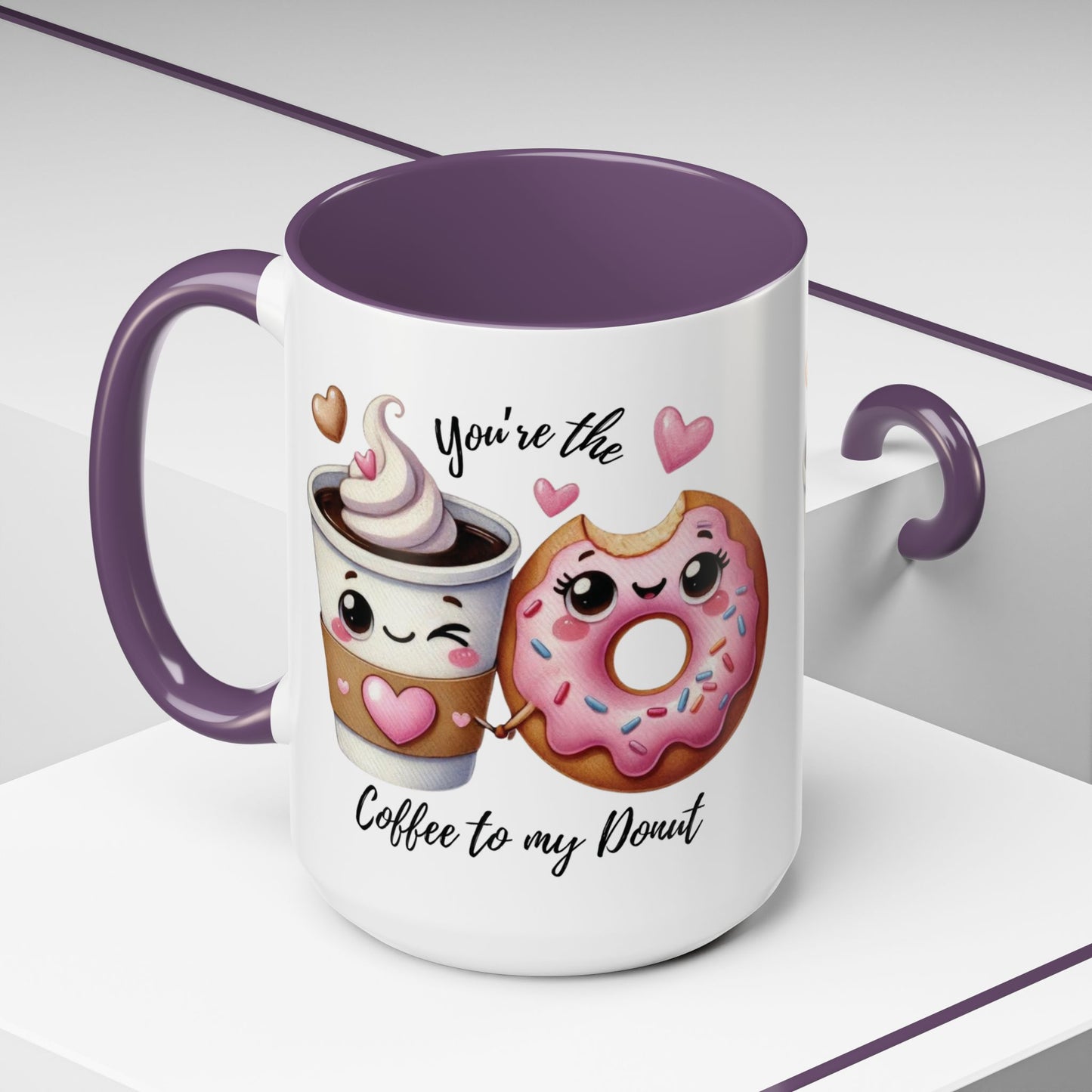 Mug with cartoon coffee cup and donut, text 'You're the coffee to my donut', purple interior and handle.
