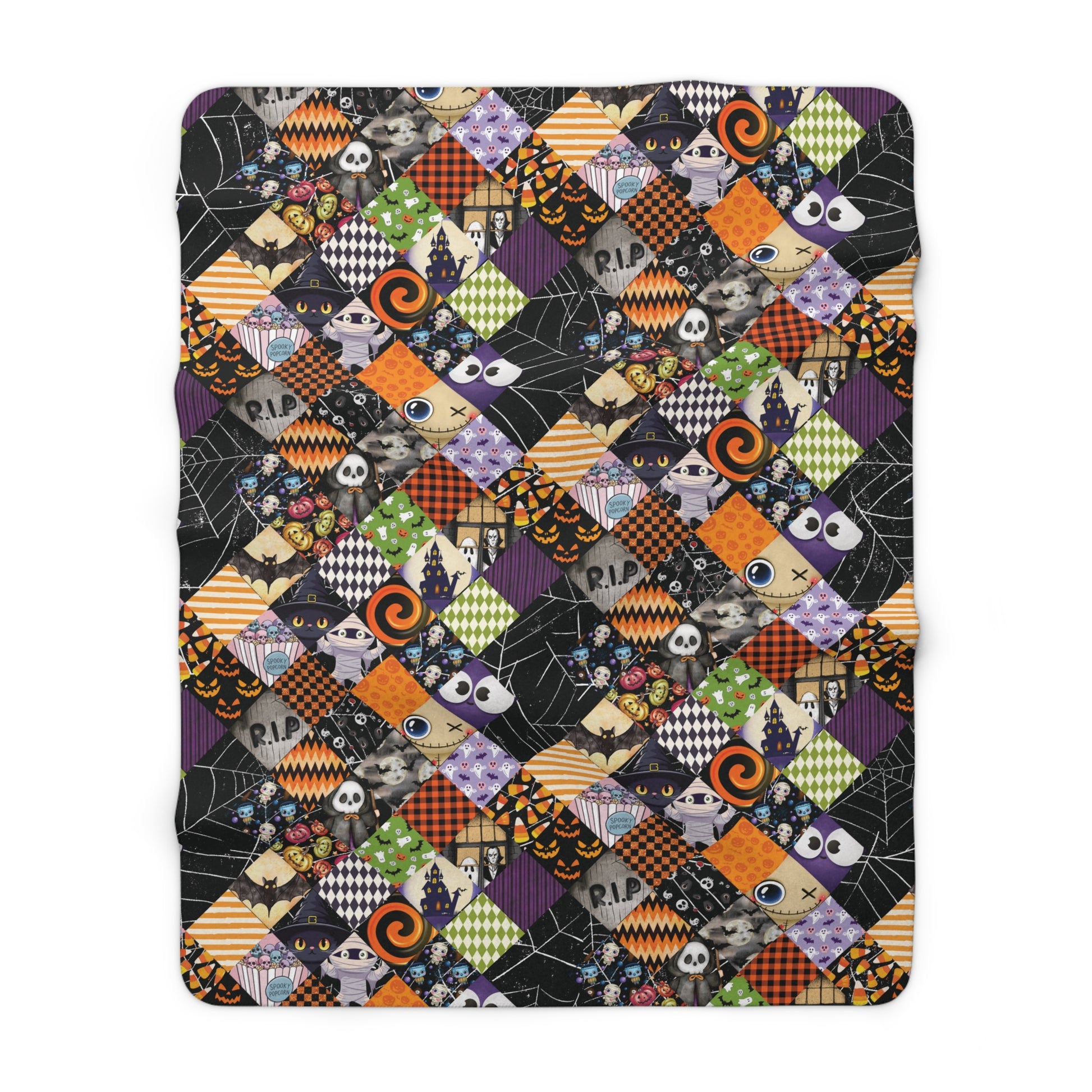 Halloween-themed quilt with colorful pattern on a white background, patchwork design