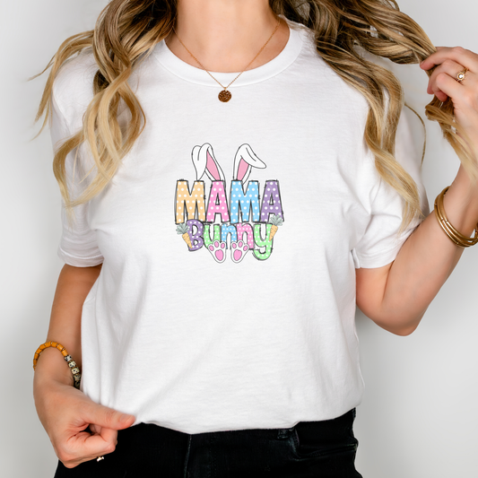 Person wearing a white t-shirt with 'Mama Bunny' text and colorful design.