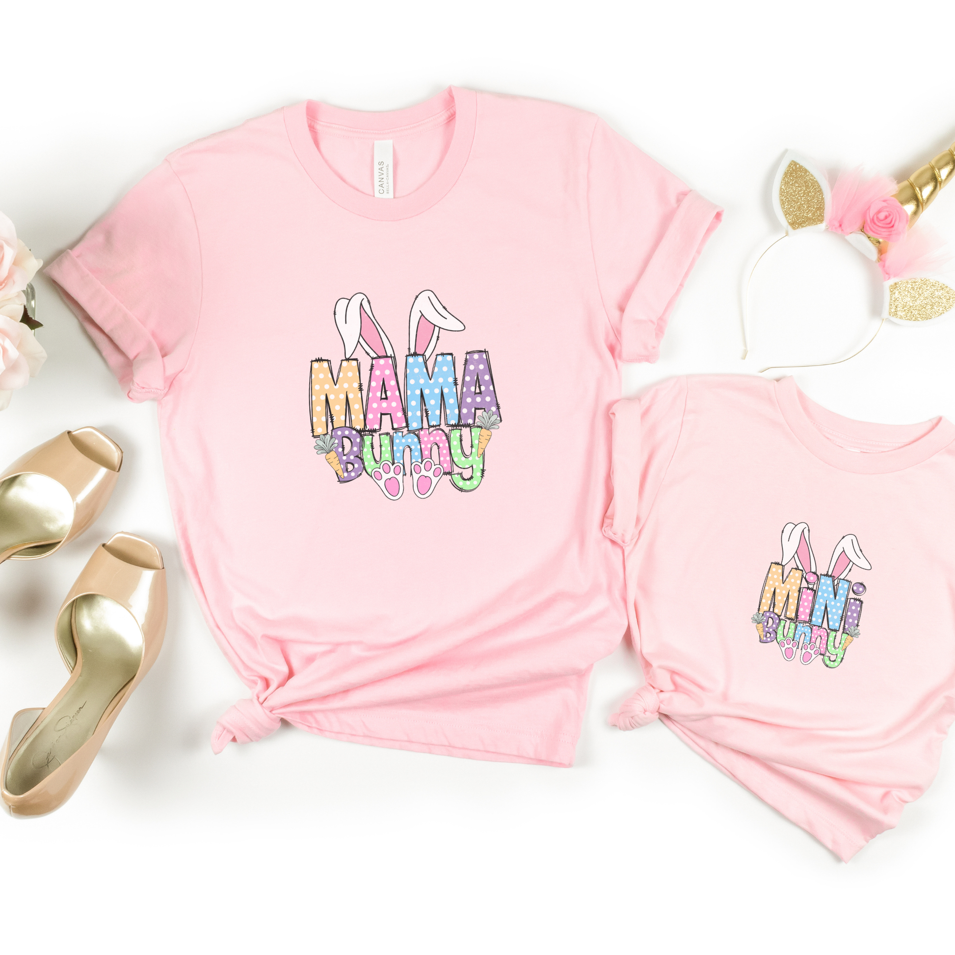 Pink t-shirt with 'Mama Bunny' and matching toddler tee on a white background