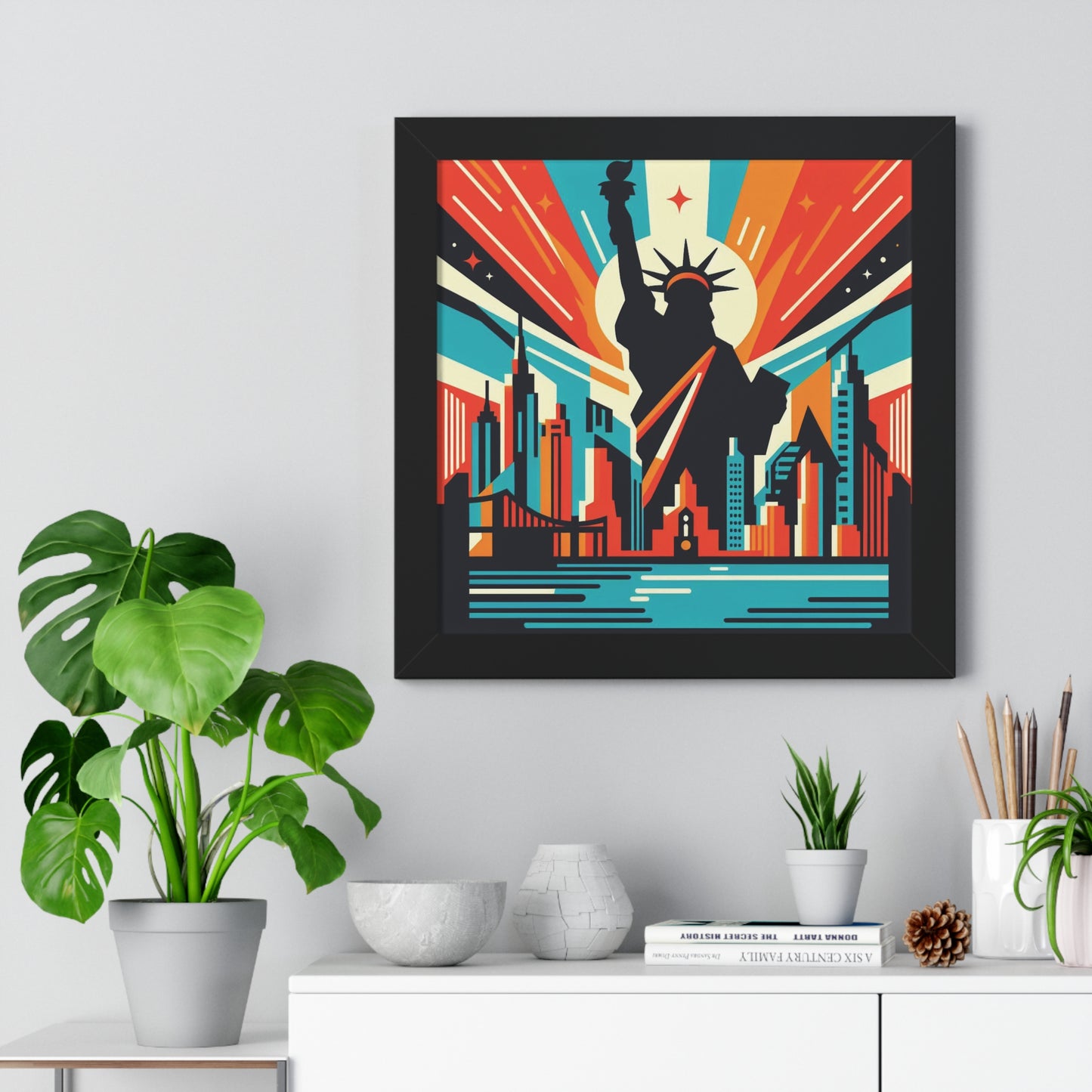 Framed artwork of a cityscape with a silhouette of a person, placed on a shelf with decorative items. nyc burst abstract art, black frame