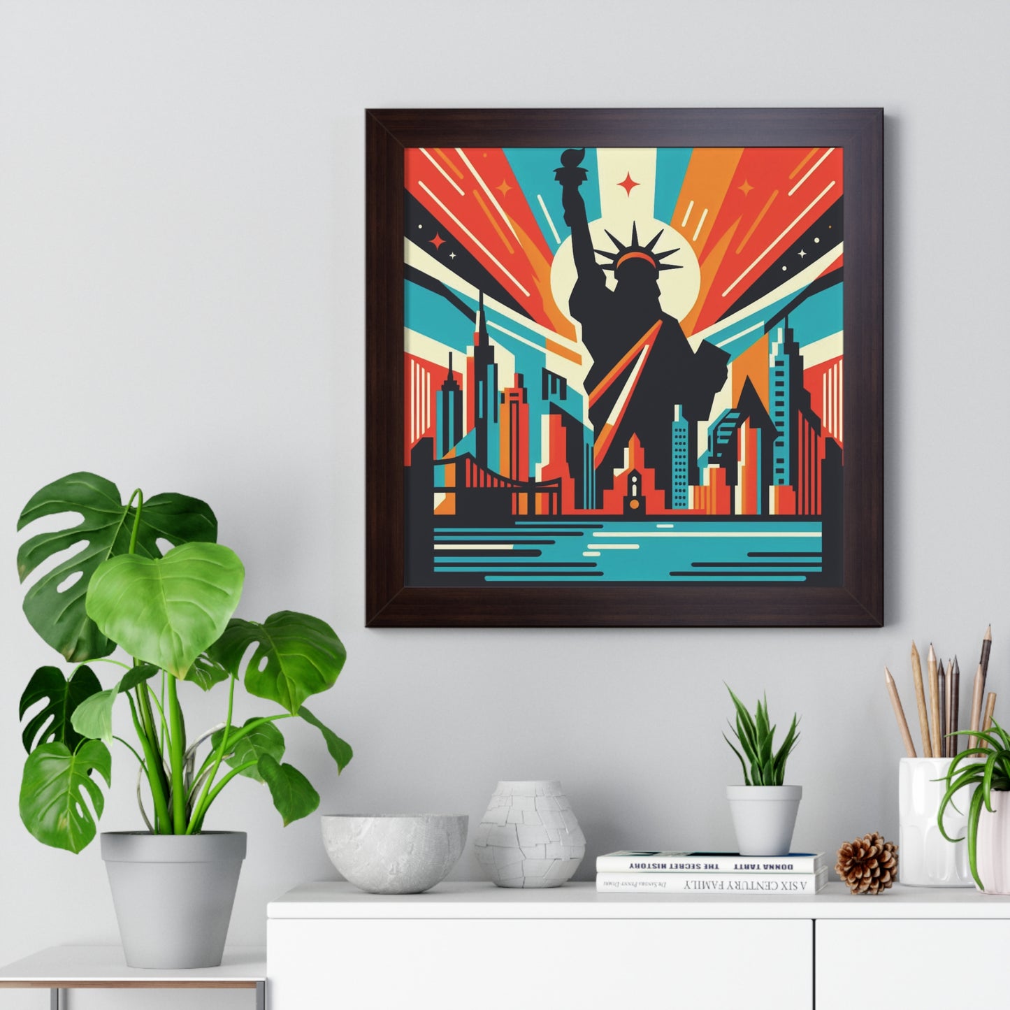 Framed artwork of a cityscape with a silhouette of a person, placed on a shelf with decorative items. nyc burst abstract art, wood frame