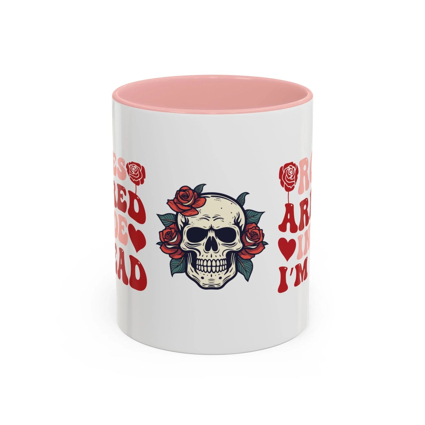 White mug with pink interior and floral skull design 