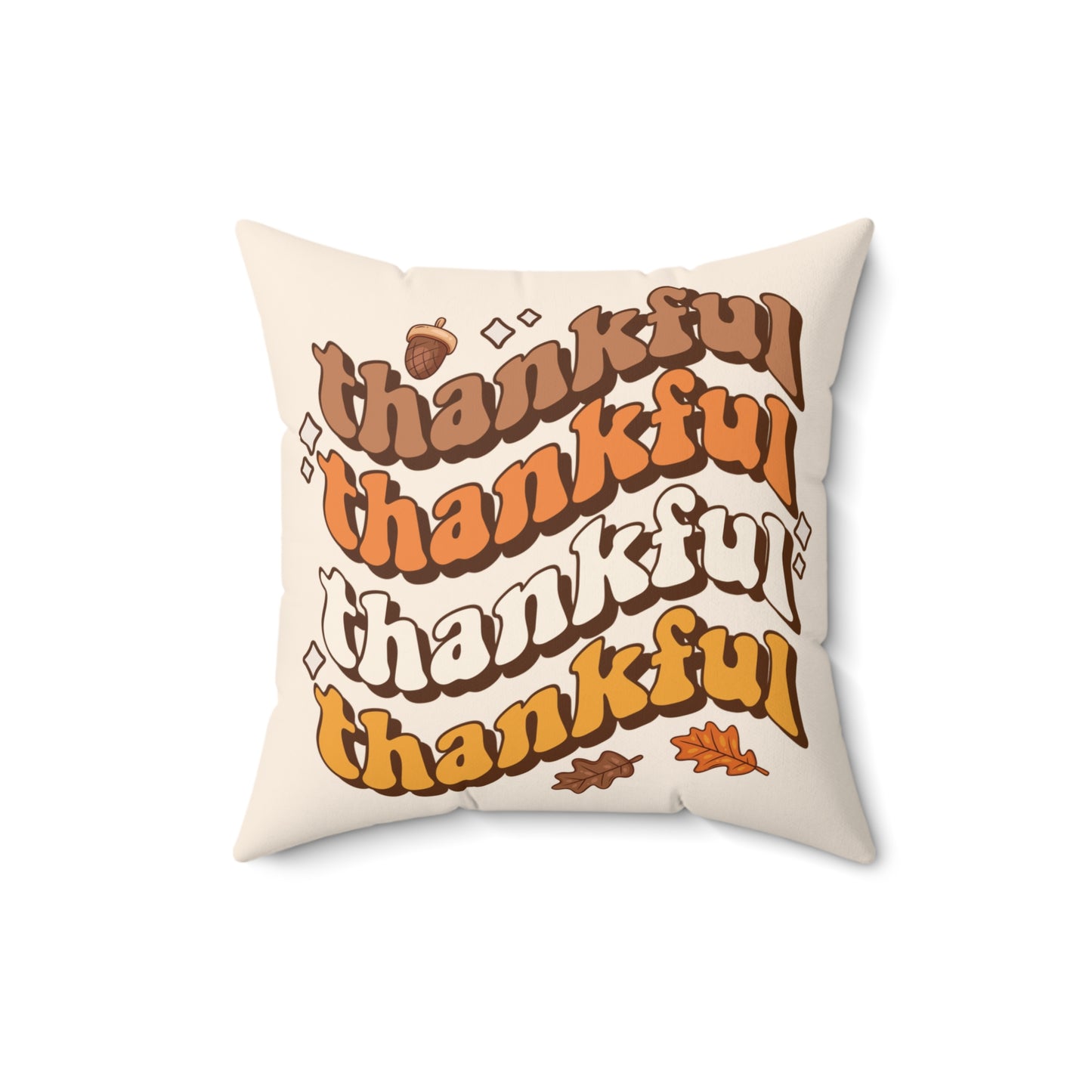 Pillow with 'thankful' text and autumn leaves on a white background