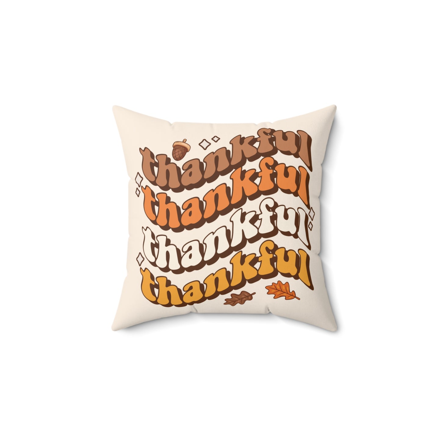Pillow with 'thankful' text in various fonts and colors on a white background