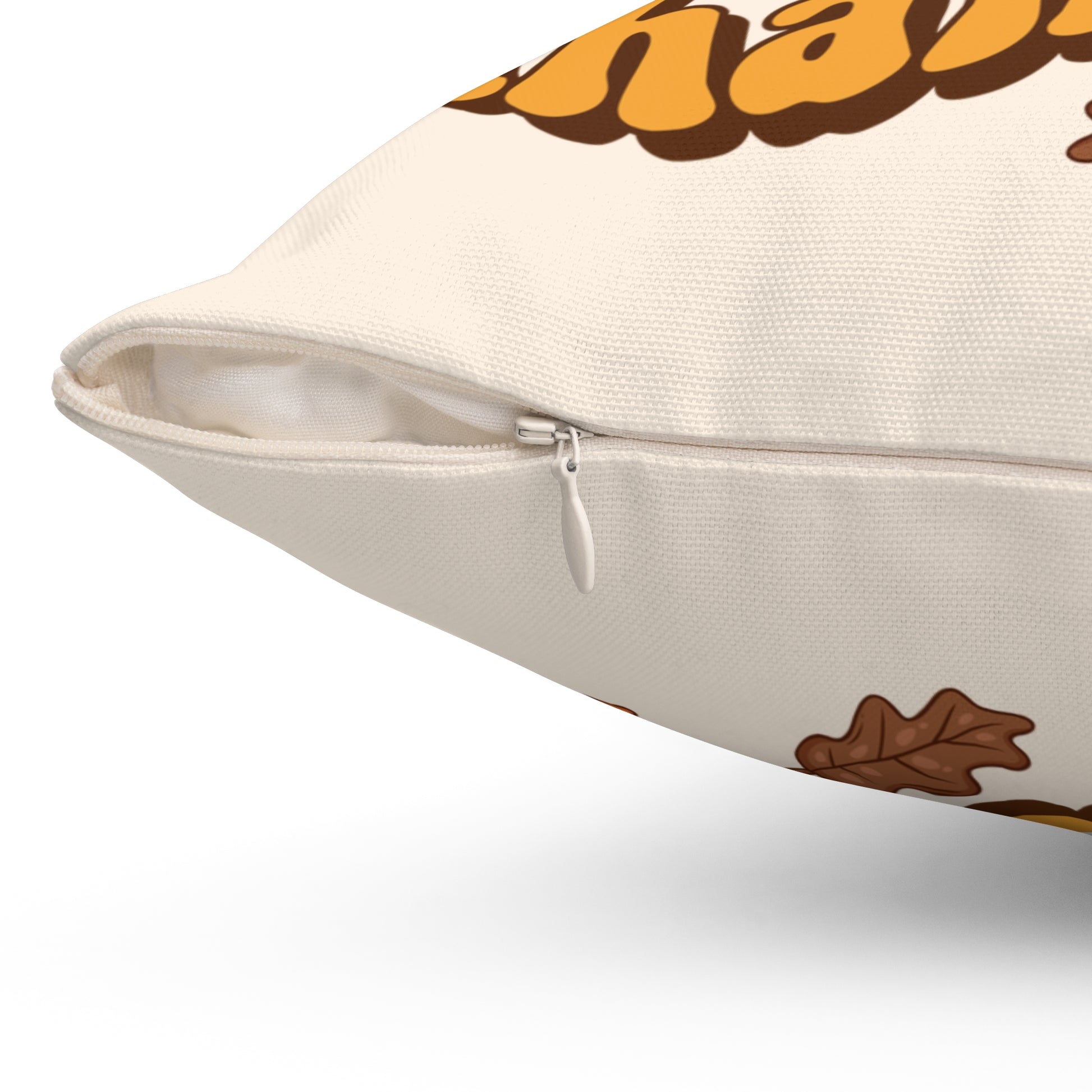 Decorative pillow with autumn-themed design on a white background