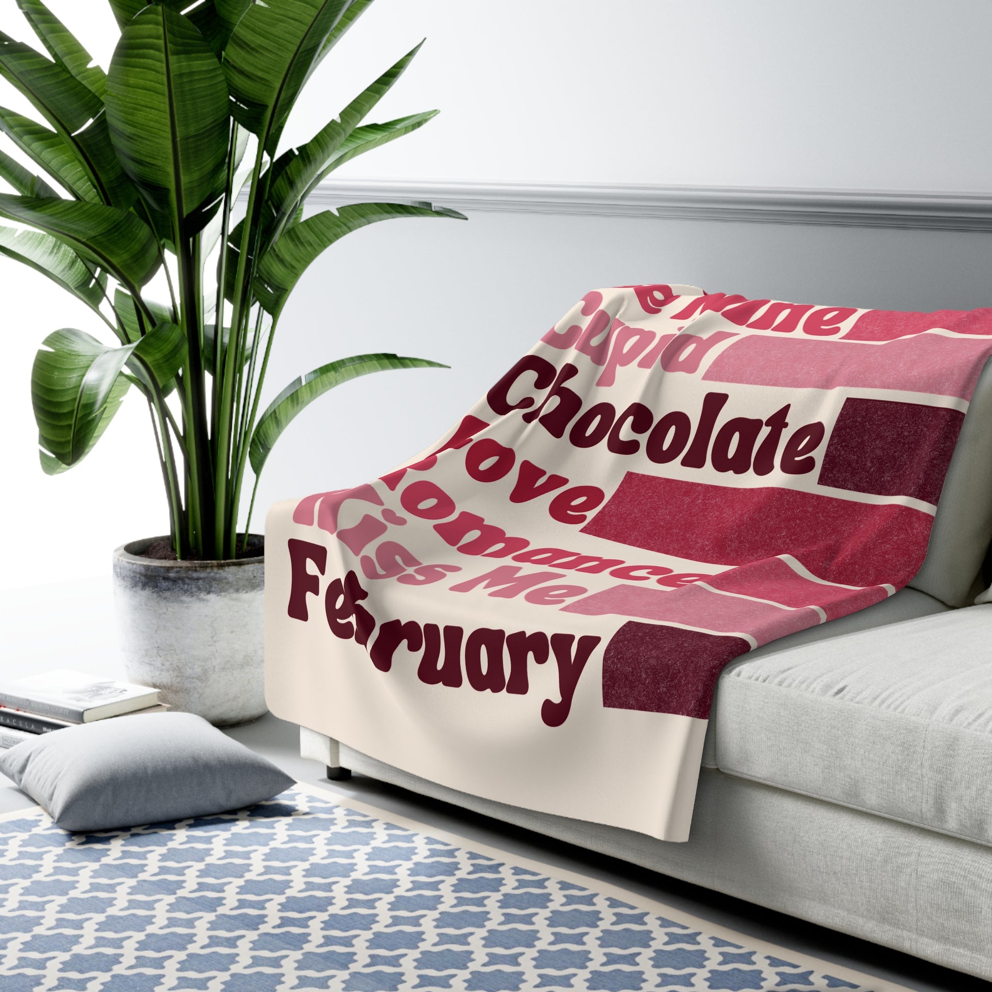 Blanket with text draped over a sofa in a living room setting, valentines word collage,